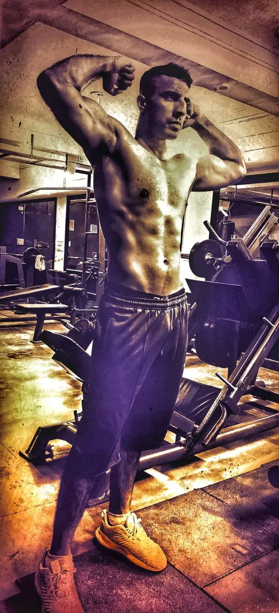 Vikram Singh Rathore posing in the gym