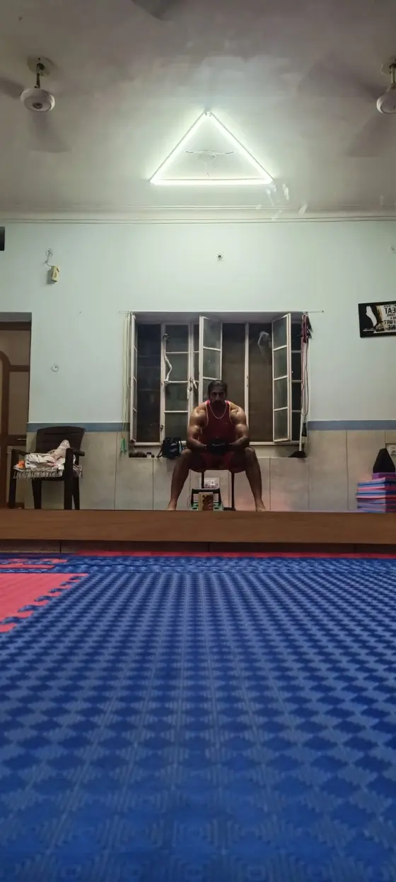 Vikram Singh Rathore seated in the training hall